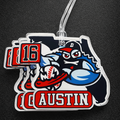 Bag tag with a sports team logo and text on a dark background