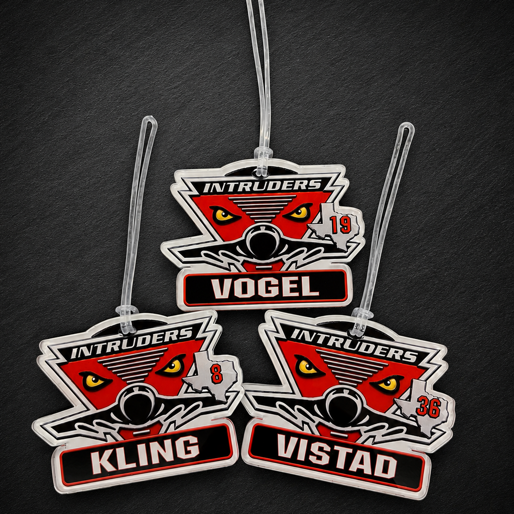 Three car air freshener tags with 'Intruders' branding on a dark textured background
