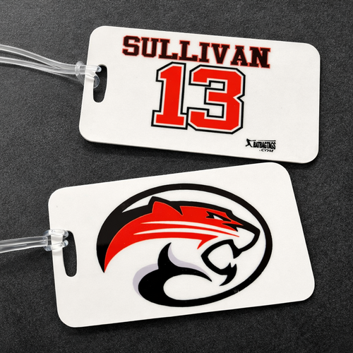 Two luggage tags with a logo and text on a dark background