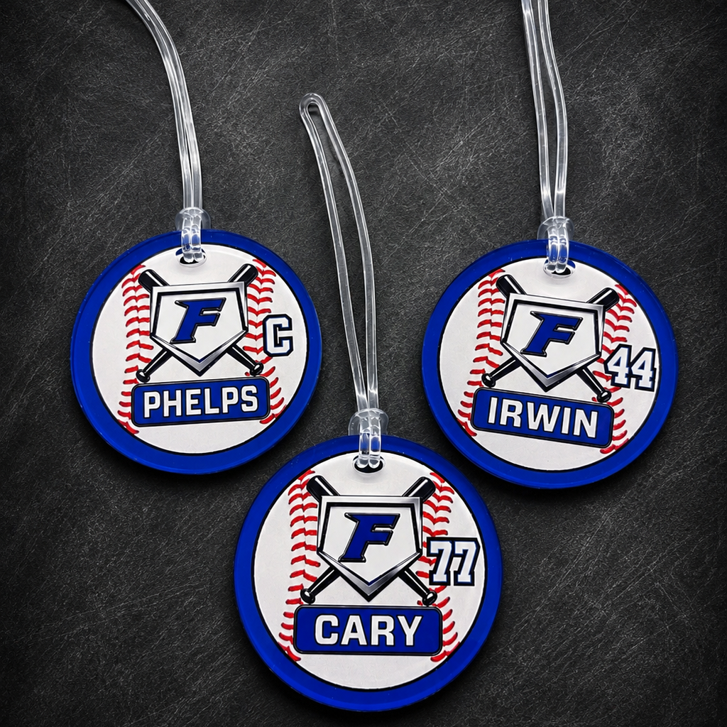 Three round tags with names and numbers on a dark background