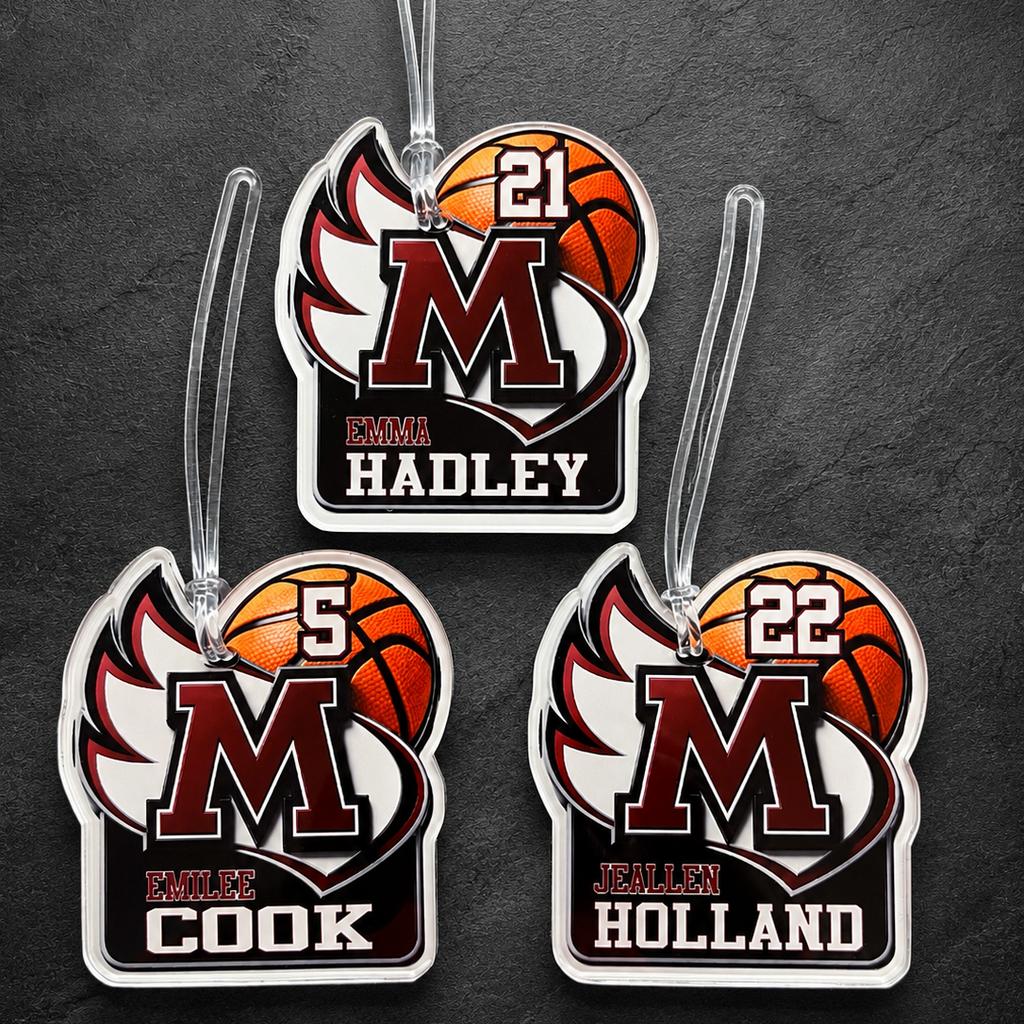 Three basketball-themed luggage tags with names and numbers on a dark background