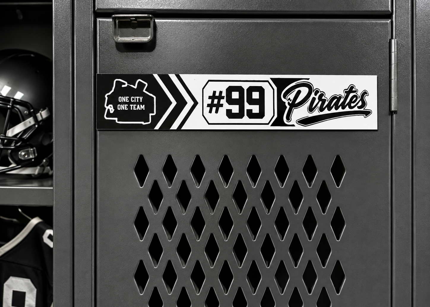A custom black and white vinyl decal sticker applied to a dark gray locker door. The sticker features a white background with black text reading '#99 Pirates' and a black outline map of Pittsburgh labeled 'One City One Team'.