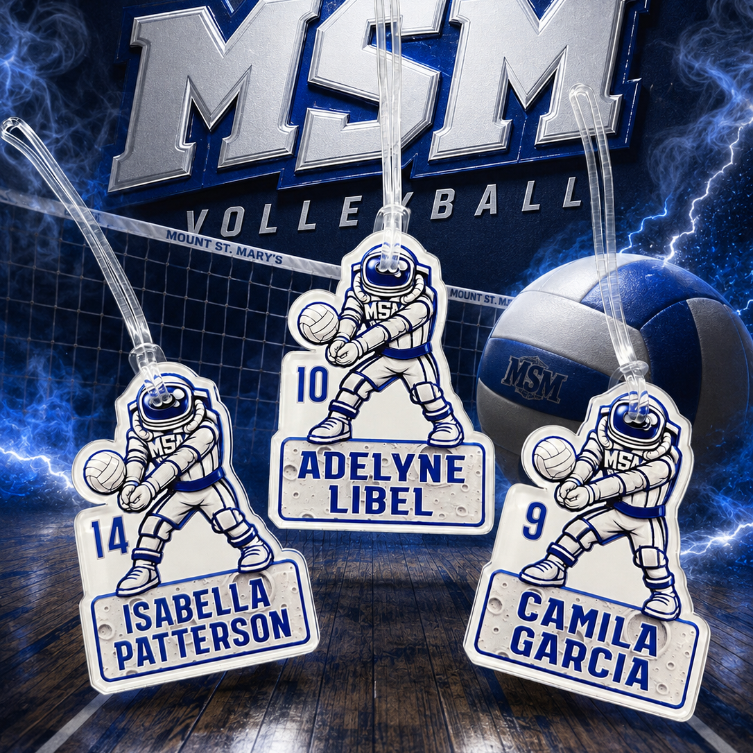 Three custom volleyball-themed luggage tags featuring astronaut players and nameplates, displayed against a themed background with a volleyball, lightning, and a large 'MSM VOLLEYBALL' logo.